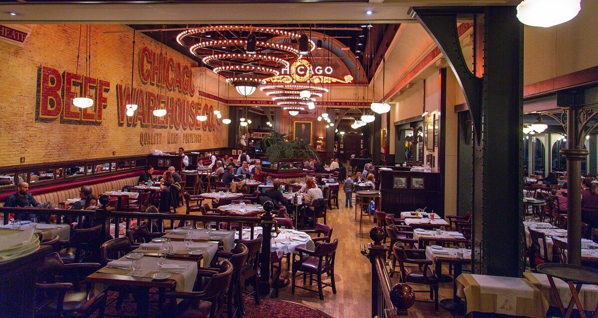 Wide shot of the Steakhouse at Disney Village Long shot of the Steakhouse at Disney Village. The restaurant is themed as if it were a classy restaurant with heavy furniture set in an old warehouse