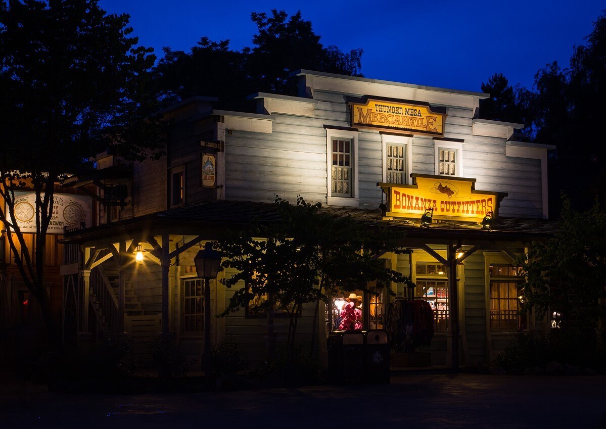 A building at night Signs on the Thunder Mesa Mercantile building are illuminated at night