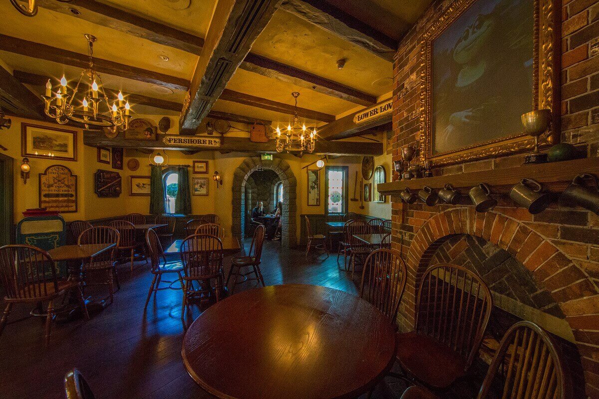 Seating area in Toad Hall View into a rustic seating area of Toad Hall with a large fireplace