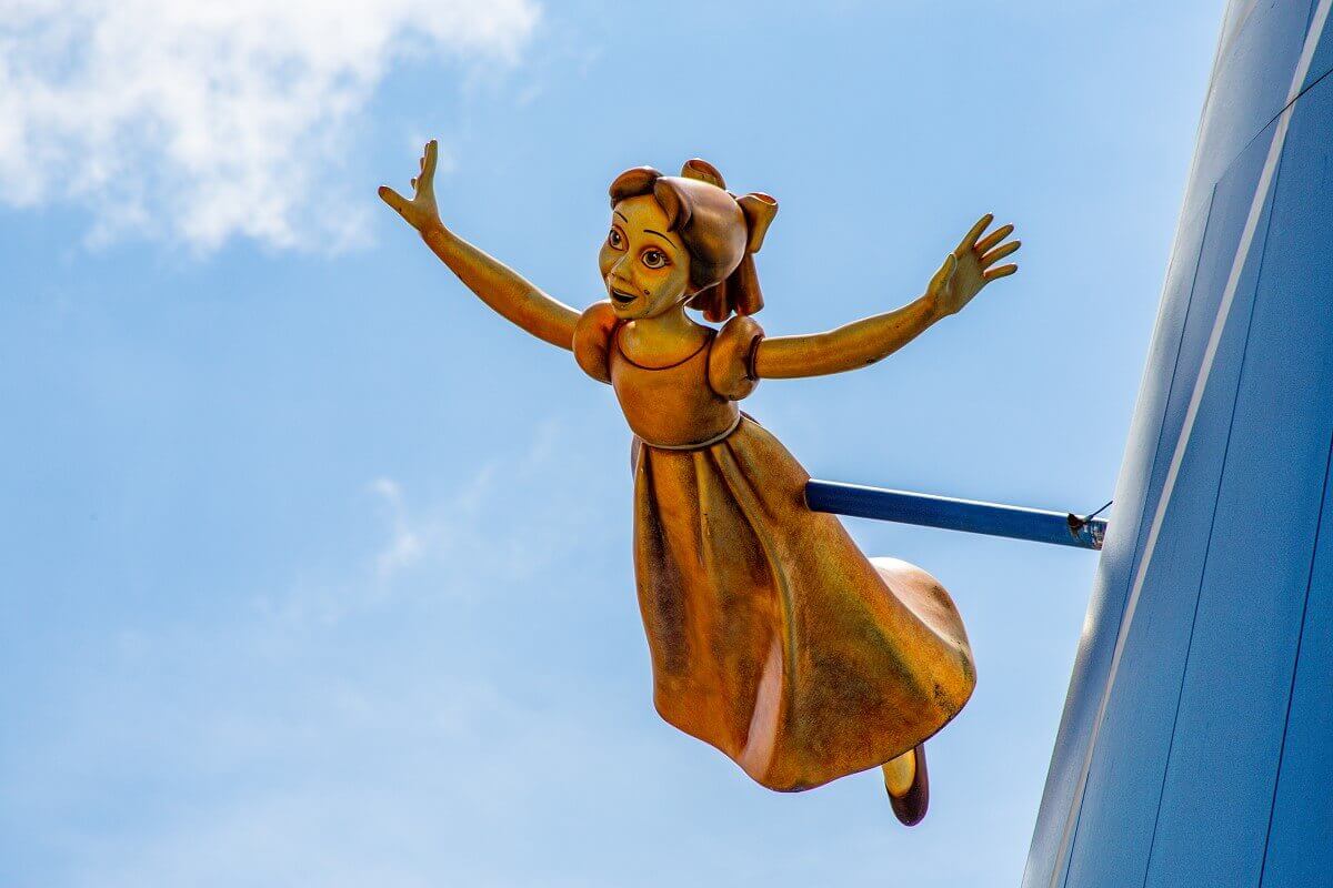 Wendy from Peter Pan A golden figure of Wendy from Peter Pan flies through the air