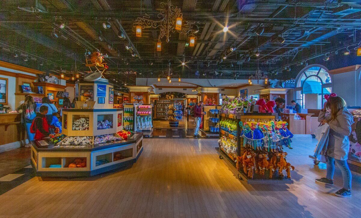 Variety of Disney Merchandise Shelves full of merchandise, one with Mr Potatoe Head sitting in a director's chair...