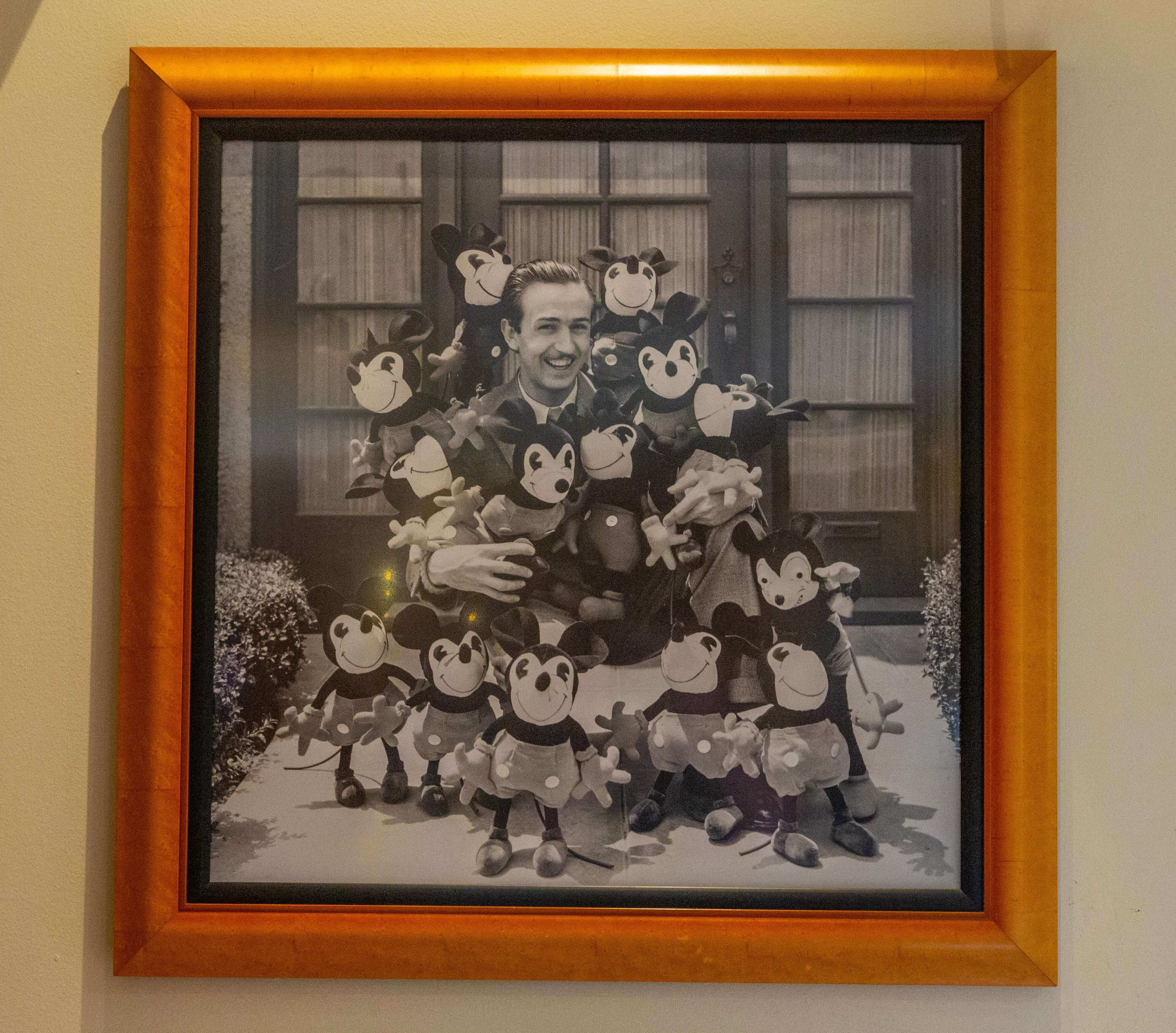 Walt Disney with Mickey Mouse Merchandise Photo of Walt Disney amidst early Mickey Mouse merchandise.