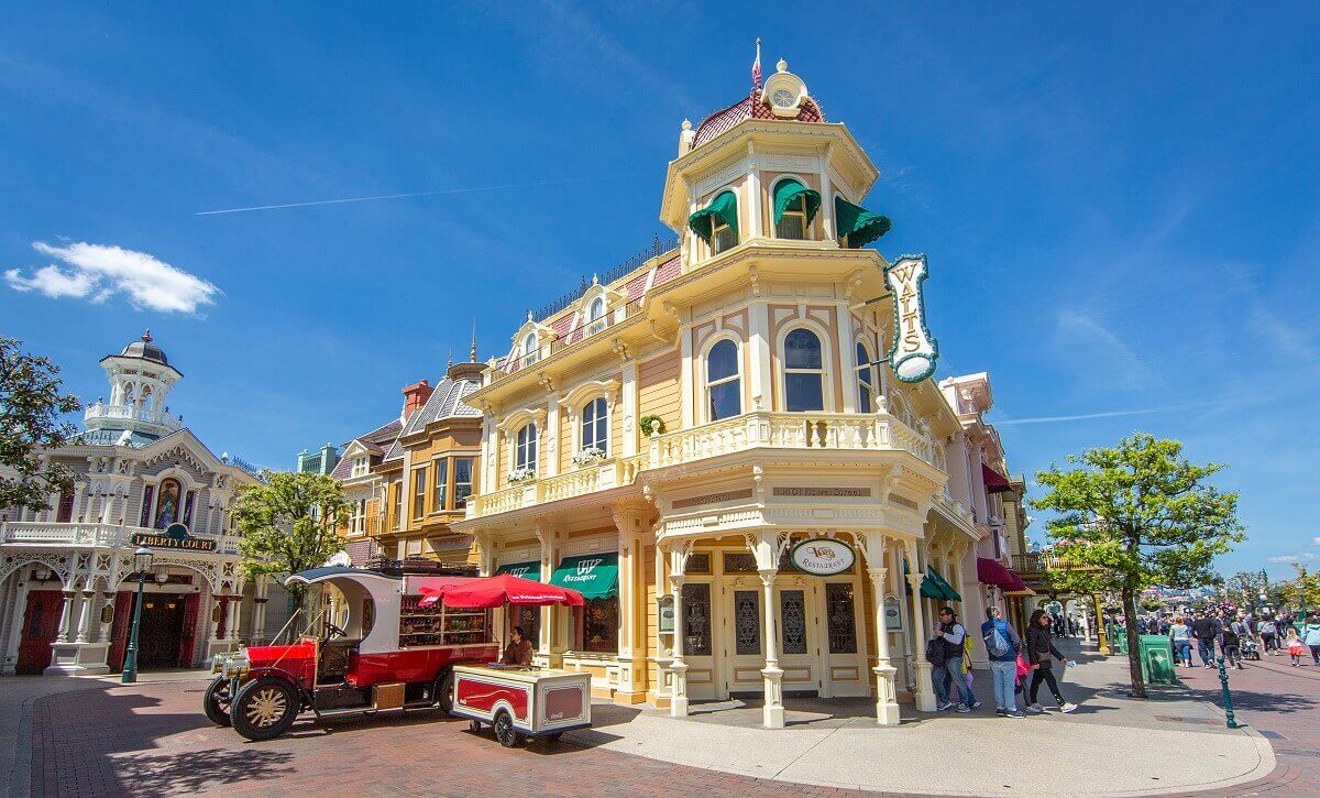 Walt's - An American Restaurant from the outside Walt's - An American Restaurant from the outside looking at the entrance at the corner of Flower Street & Main Street. On the left in Flower Street the Coca Cola Truck and the entrance to Liberty Court.