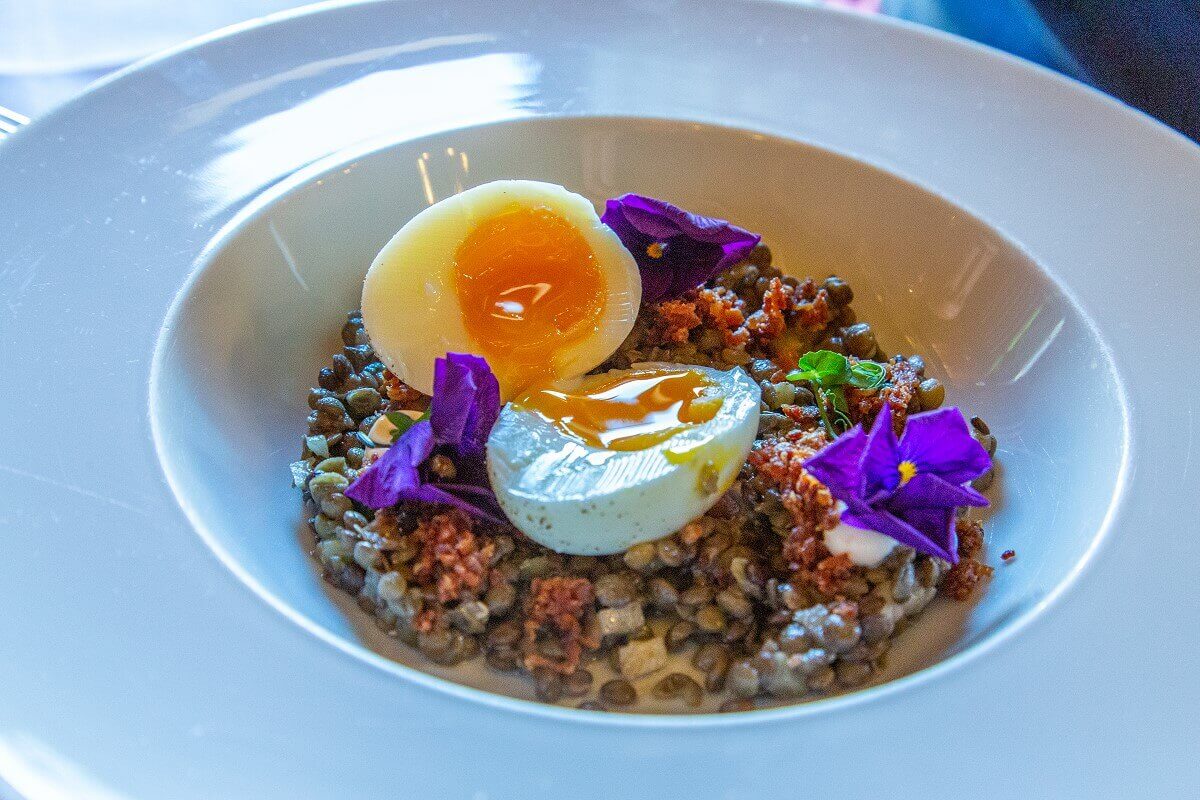 Waxy egg on lentil salad, cut open Waxy egg on lentil salad, cut open